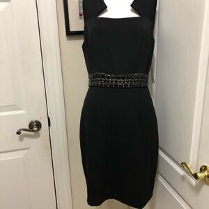 Donna Ricco fancy dress with unique front cut